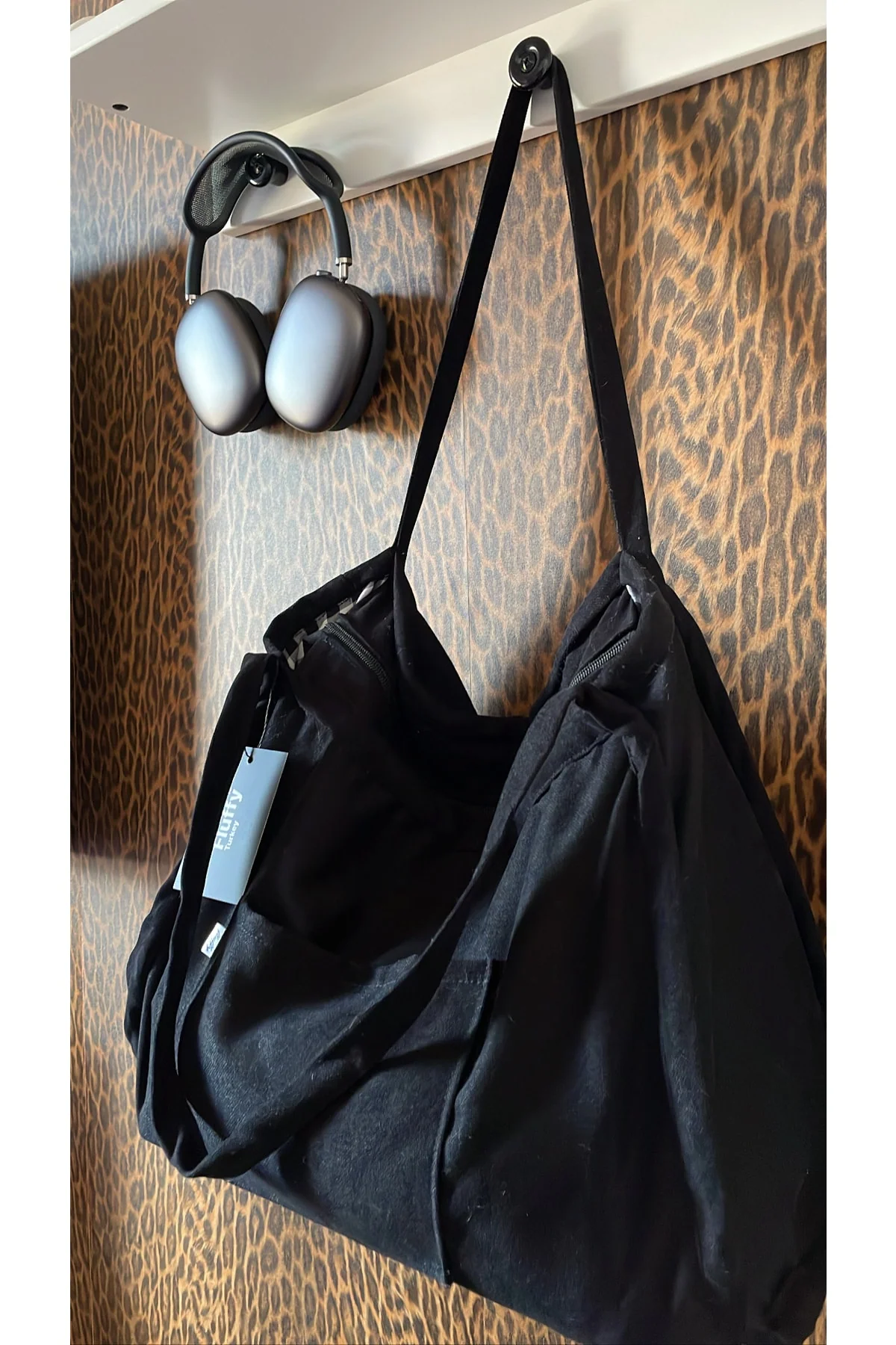 Classic black tote bag with zipper and pockets