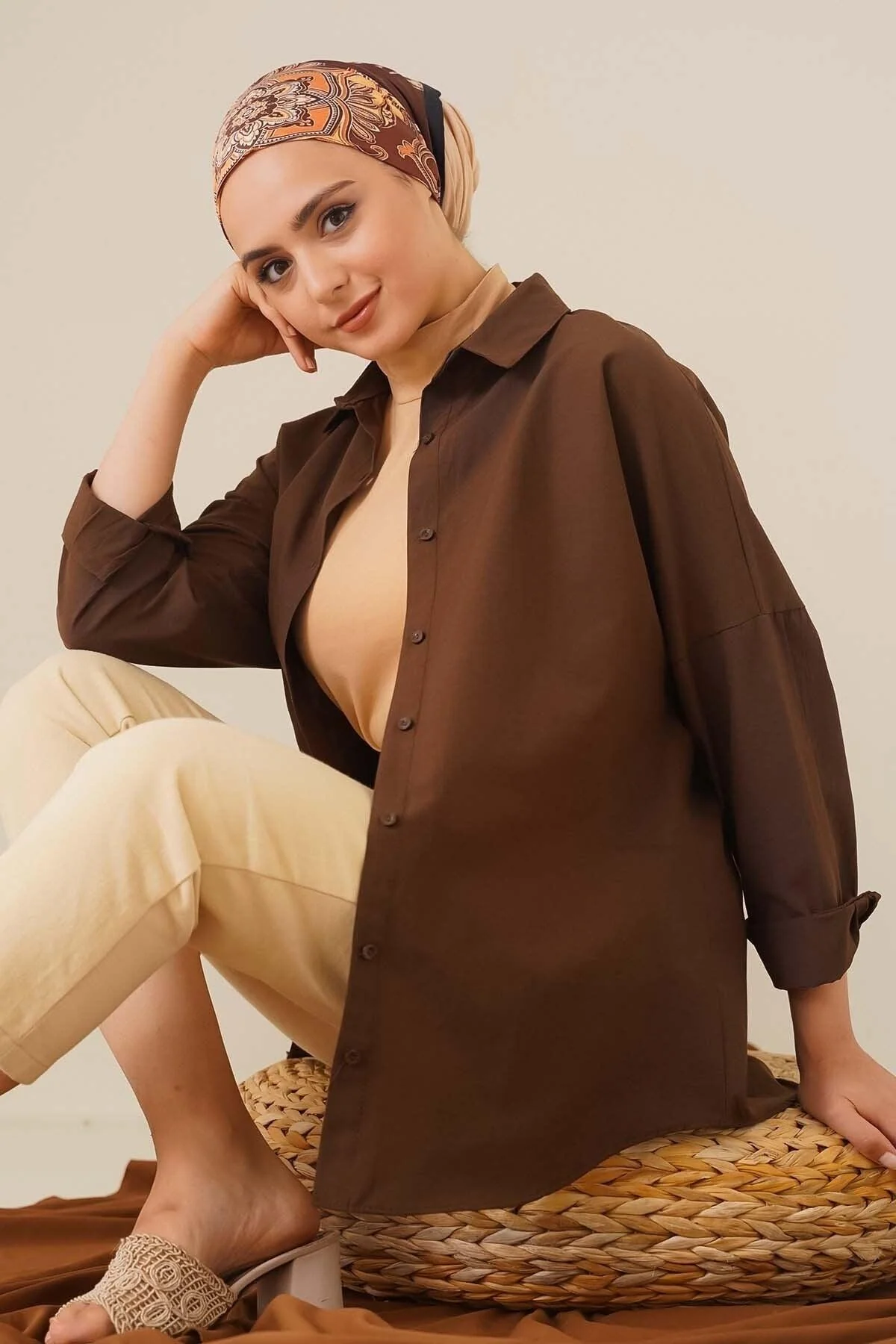 Oversized brown shirt with dropped shoulders and classic buttons