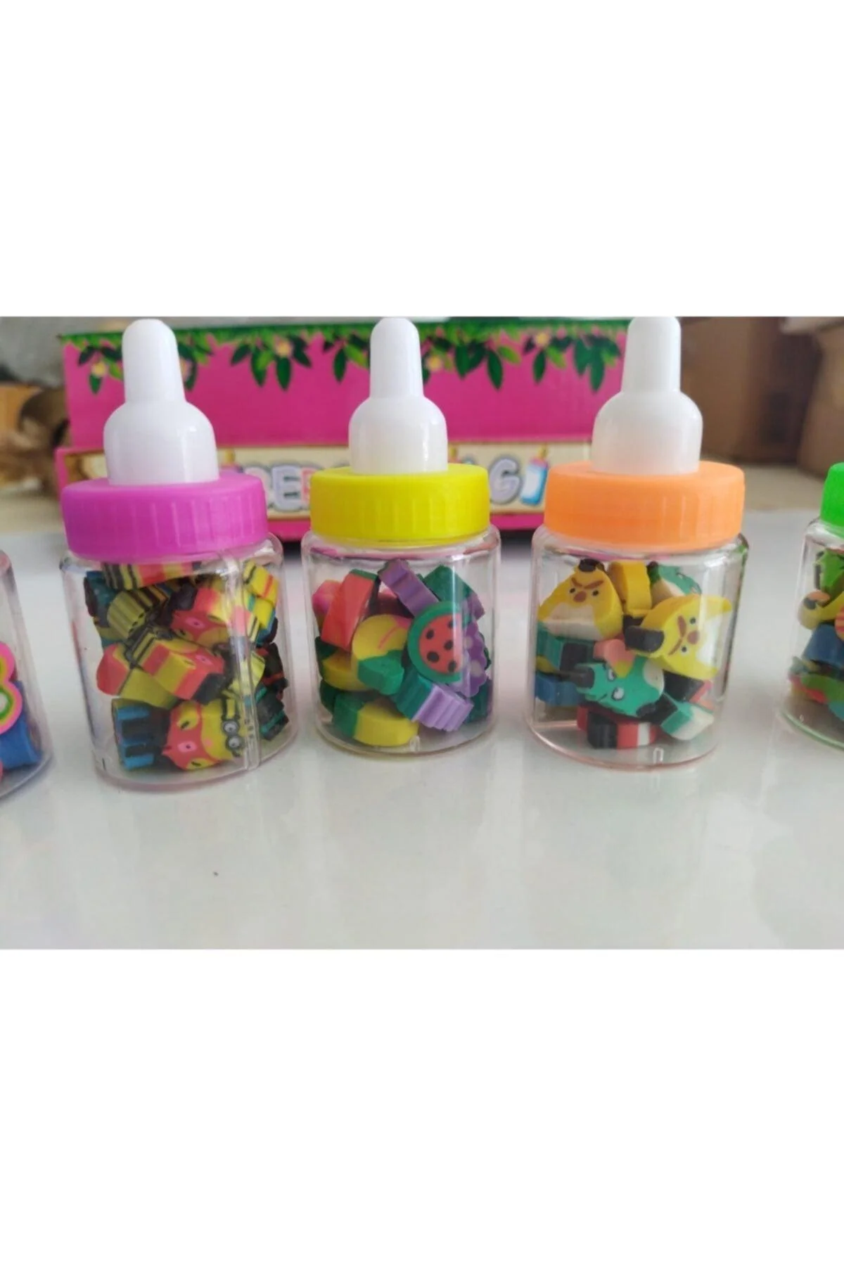 Set of 10 colorful gum erasers in peppermint bottle