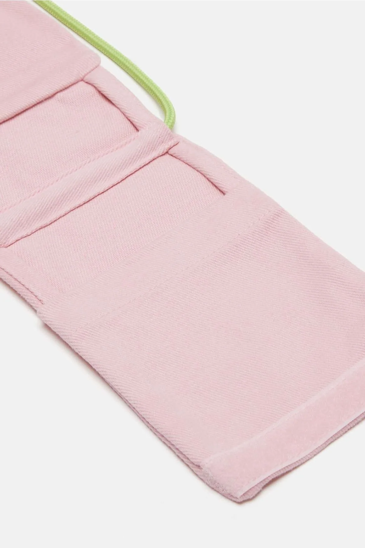 Pink adjustable drawstring phone bag with zipper closure