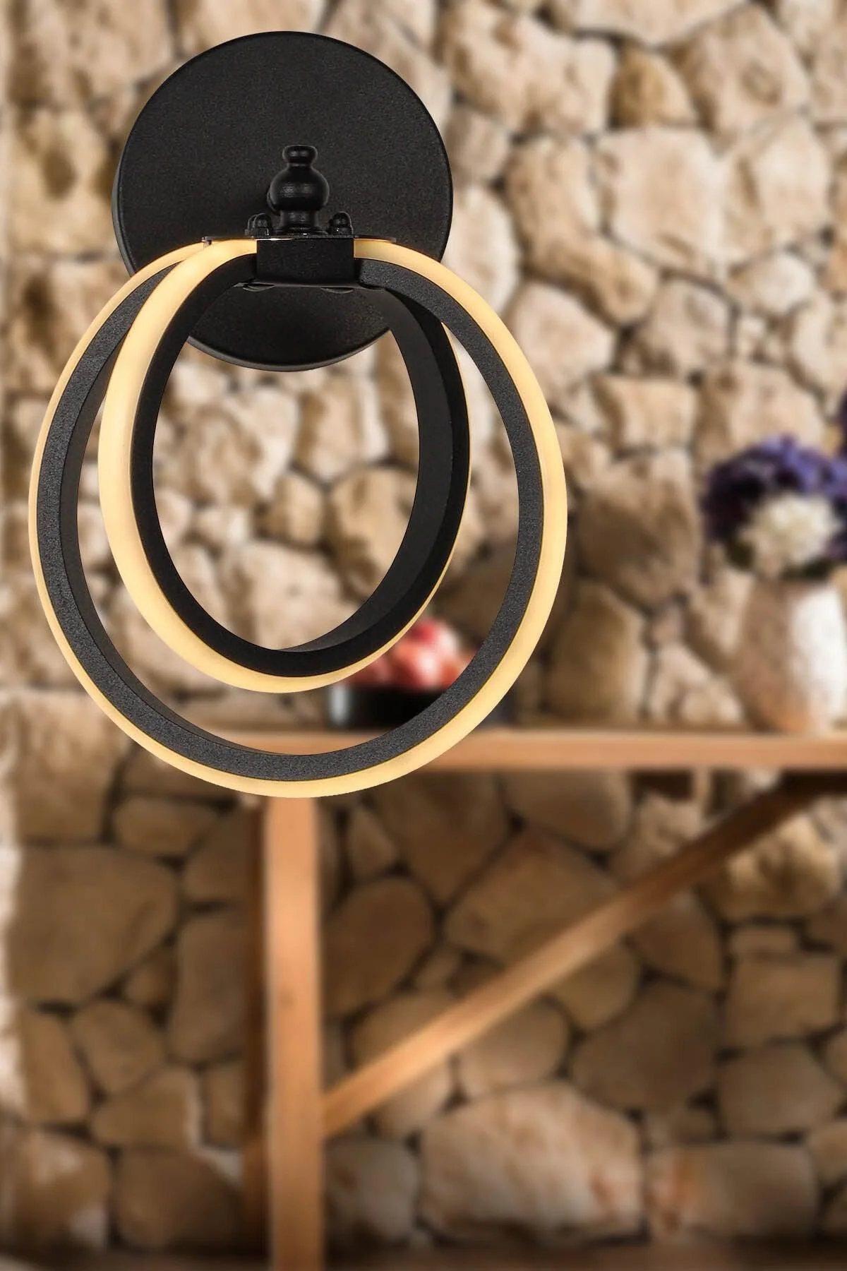 Black aluminum wall sconce with daylight LED compatibility