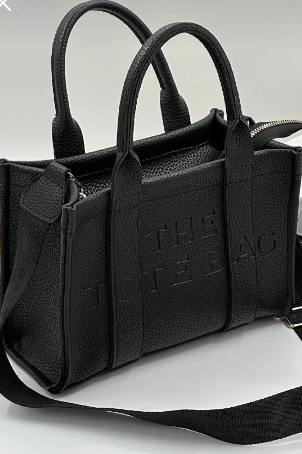 Minimalist leather tote bag with adjustable strap