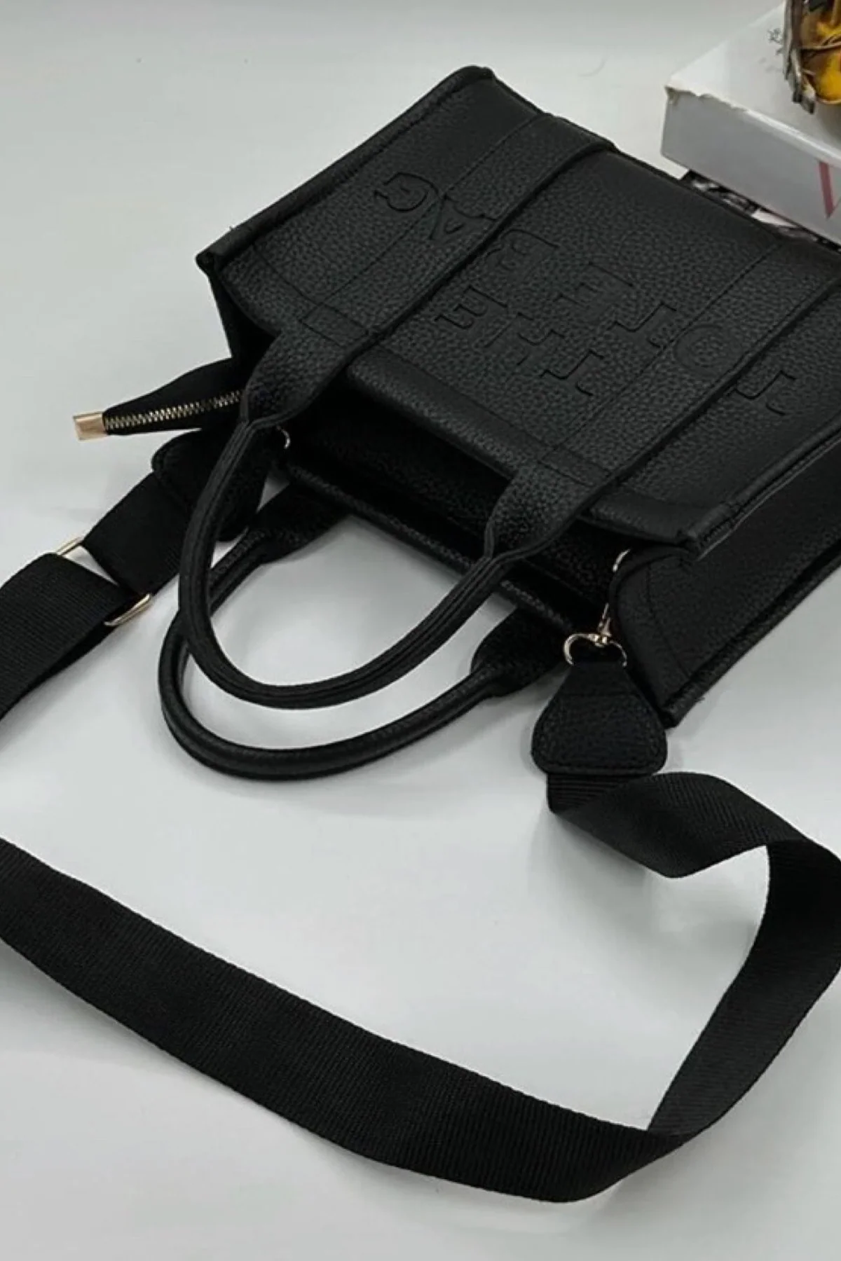 Minimalist leather tote bag with adjustable strap