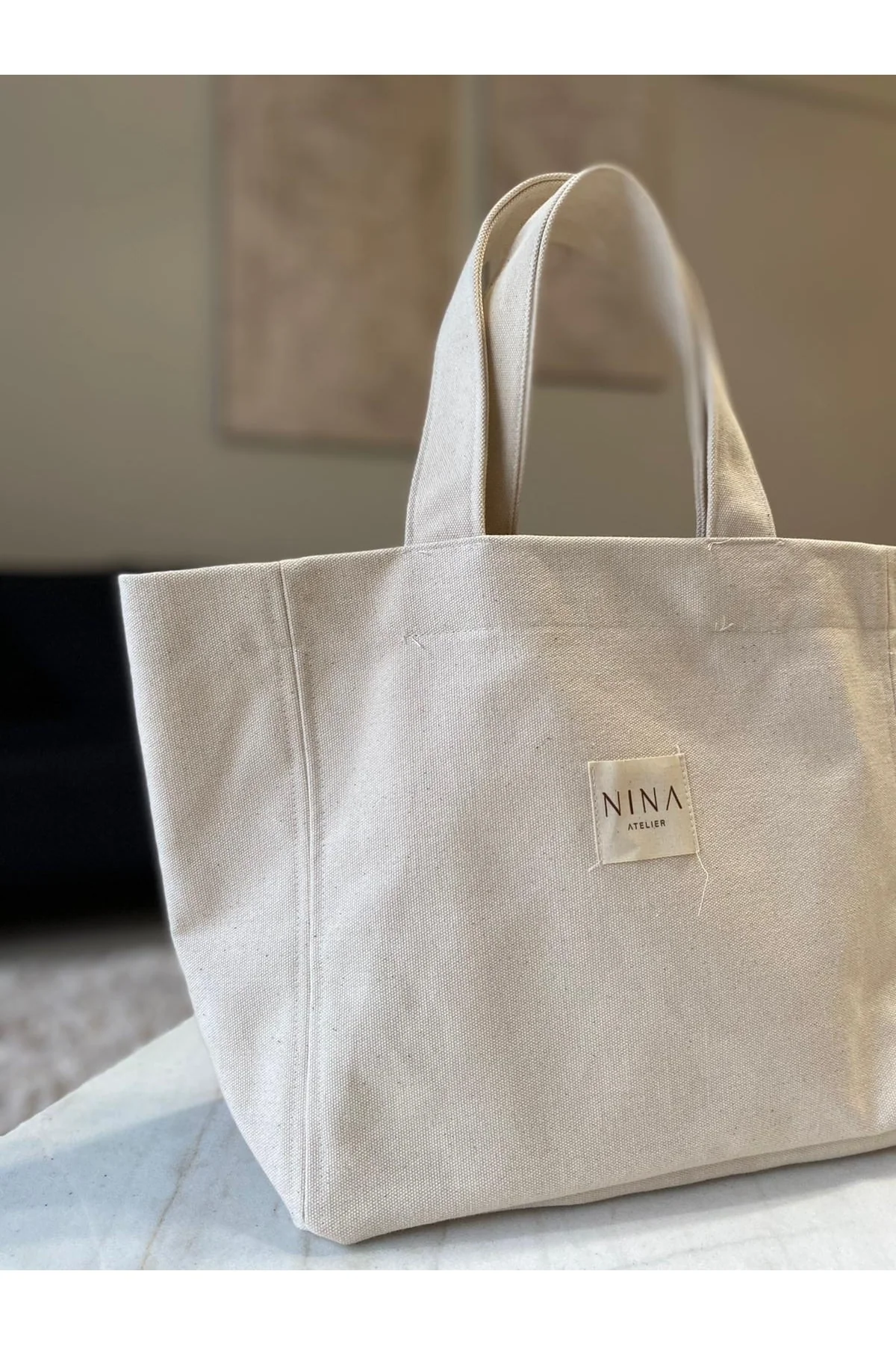 Small linen tote bag with sleeve handles for everyday essentials