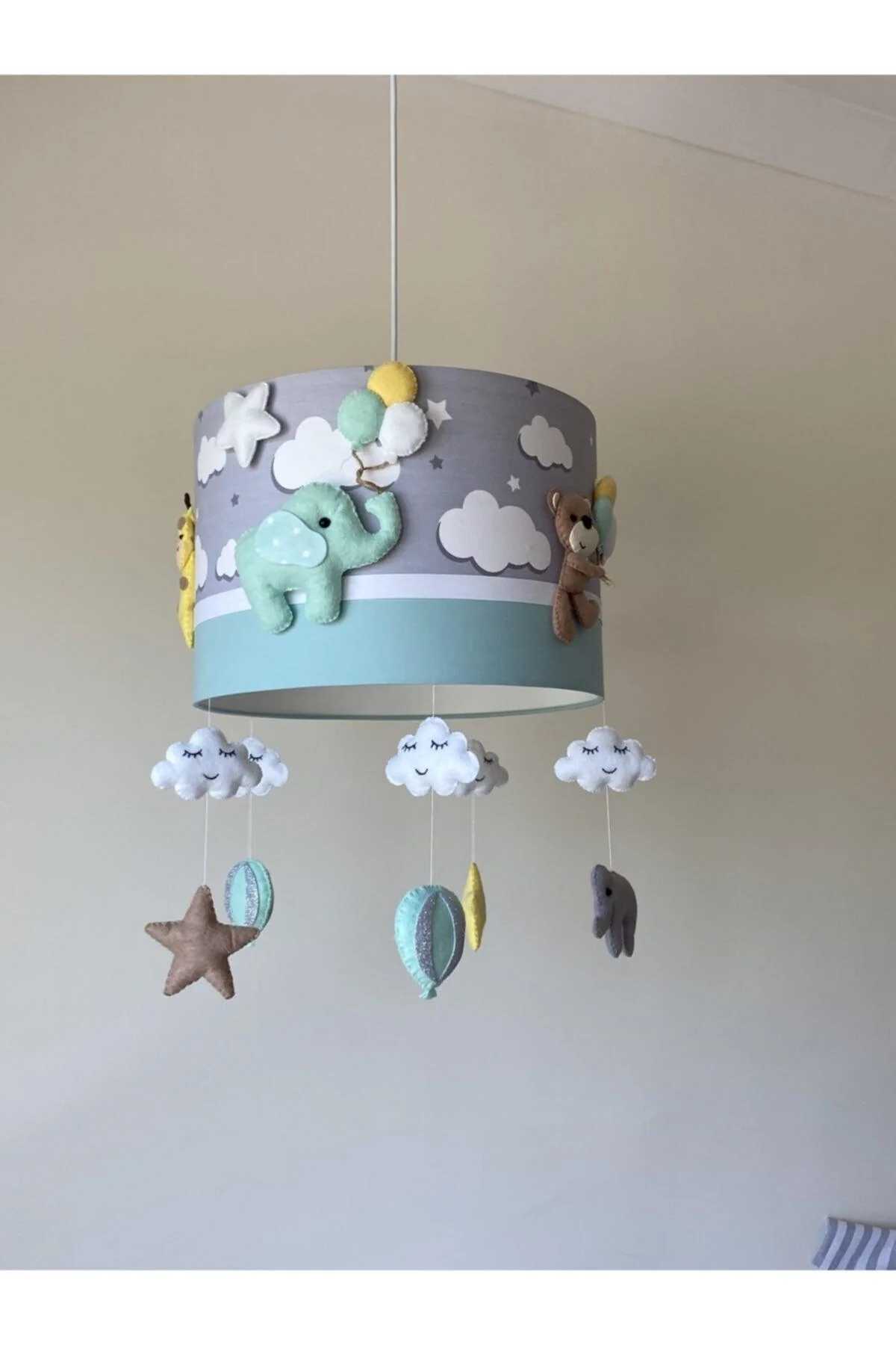 Whimsical animal-themed chandelier with hand-stitched felt figures