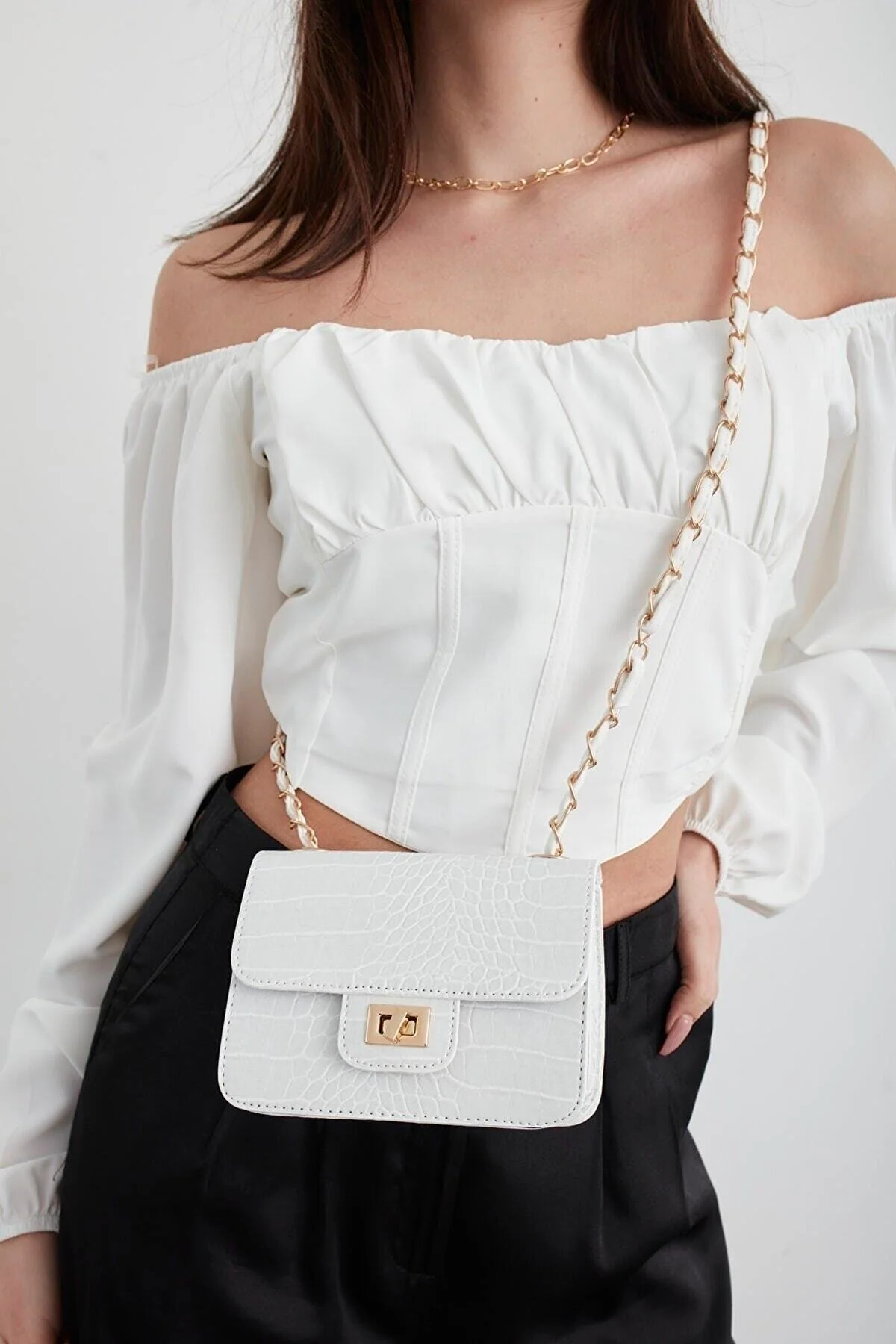 White crocodile-patterned mini shoulder bag with chain hanger and lock