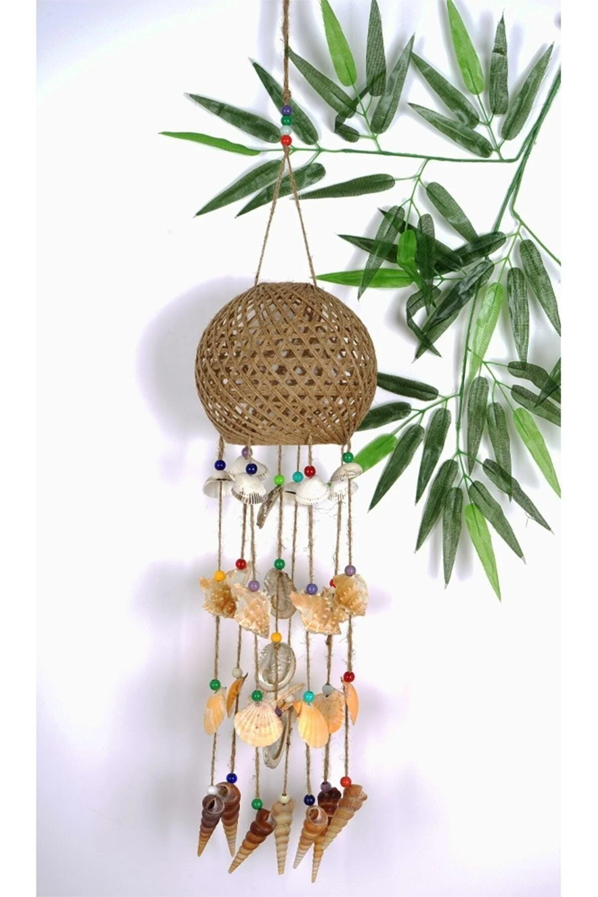 Large seashell wind chime with straw cage for outdoor relaxation