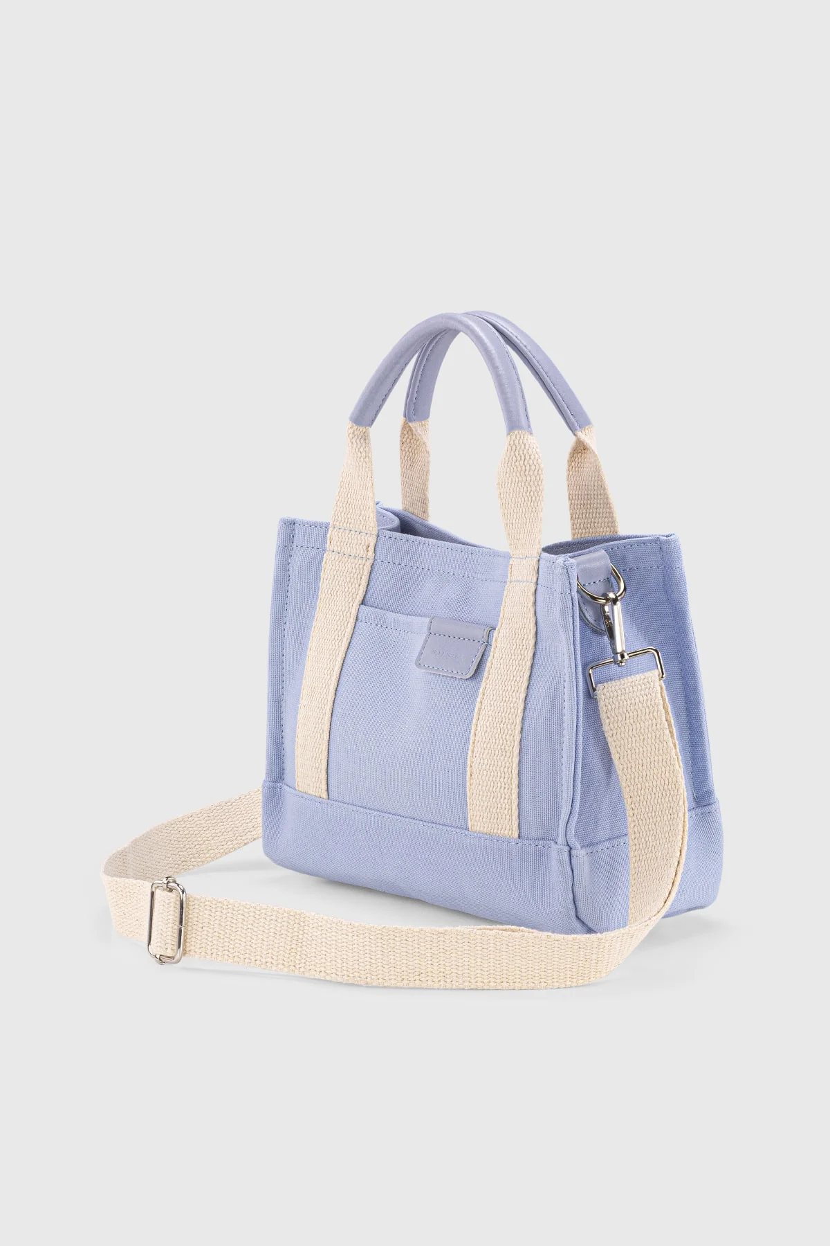 Blue canvas tote bag with polyester lining and adjustable strap